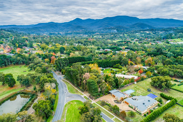 Fototapeta na wymiar Aerial landscape of rural houses among trees in fall. Healesville, Victoria, Australia