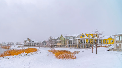 Panorama Frosty landscape with lake and homes in Daybreak