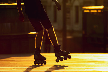 Fototapeta premium silhouette pairs of legs on roller skates. sports and leisure