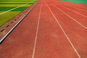 A gymnasium with runways, bleachers, and soccer fields