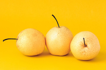 Pear shot against a solid color background
