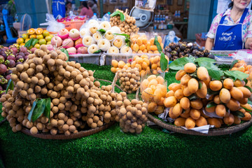 longan and sweet yellow marian plum at fruit store