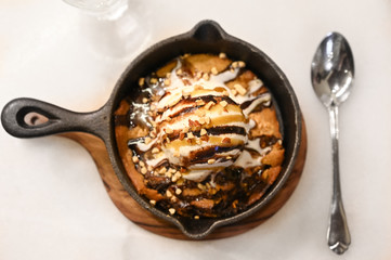 Vanilla ice cream with cookies in a pan