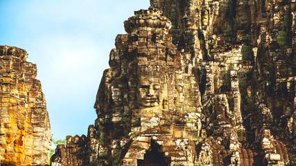 Fototapeta premium The Stone face of Bayon Castle . Khmer ancient Angkor Wat in Siem Reap, Cambodia
