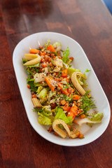Vegan salad with greens, mini-corn, chickpea and quinoa