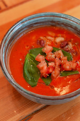 Cold vegetarian gazpacho with herbs, tomatoes and basil