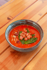 Cold vegetarian gazpacho with herbs, tomatoes and basil