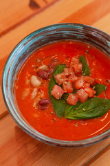 Cold vegetarian gazpacho with herbs, tomatoes and basil