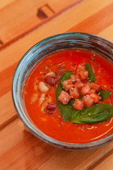 Cold vegetarian gazpacho with herbs, tomatoes and basil
