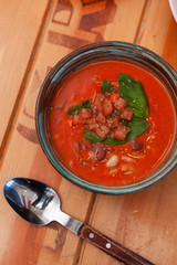 Cold spanish gazpacho with basil and herbs for detox diet diner