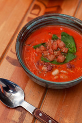 Cold spanish gazpacho with basil and herbs for detox diet diner