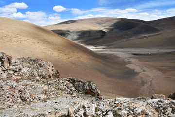 China, Tibetan Autonomous region. Summer mountain landscape 18 km from lake Gomang, the bed of a small mountain river