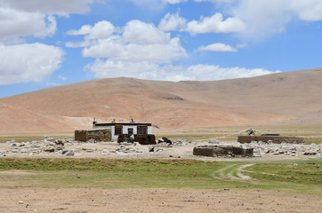 China. Tibetan house high in the mountains in summer