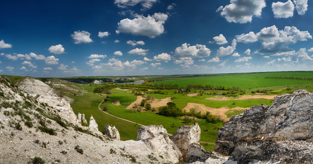 Fototapeta na wymiar Panorama of Chalk cliffs. Late Cretaceous. Landscape with clouds.