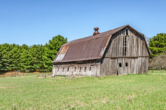 Weathered Gray Barn with Rusty Metal Roof 