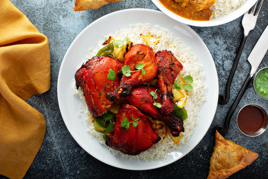 Whole tandoori chicken with jasmine rice, indian food