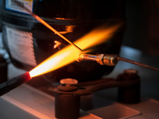 Gas welding using copper brazing rod technique. Welding copper pipes