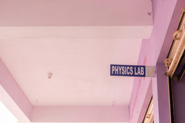 Board showing of Physics lab at the entrance of the class room in college