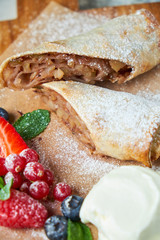 Apple strudel. Gray textured background. Beautiful serving dishes. Dessert. Food chain