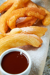 Churos spanish dessert. Gray textured background. Beautiful serving dishes. Dessert. Food chain