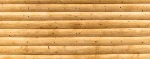 The logs are bright yellow. Wooden plank background