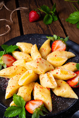 Kopytka - polish potato dumpling with strawberries