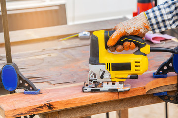 The yellow jigsaw for wood working.