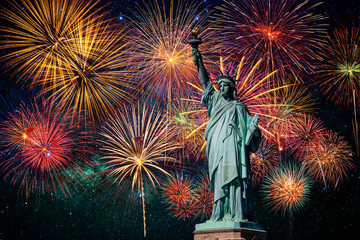 Statue of Liberty over the Multicolor Fireworks Celebrate with the milky way background, 4th of...