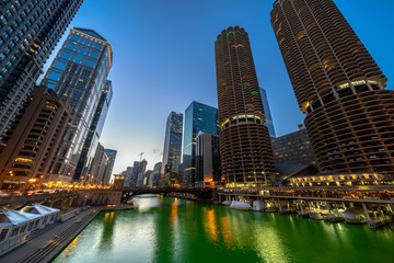 Fototapeta premium The Chicago riverwalk cityscape river side at the twilight time, USA downtown skyline, Architecture and building with tourist concept