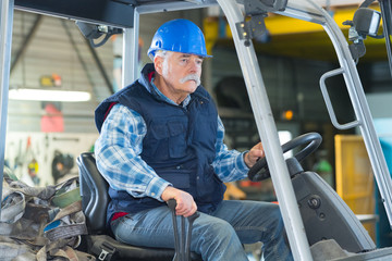 man driving forklift truck