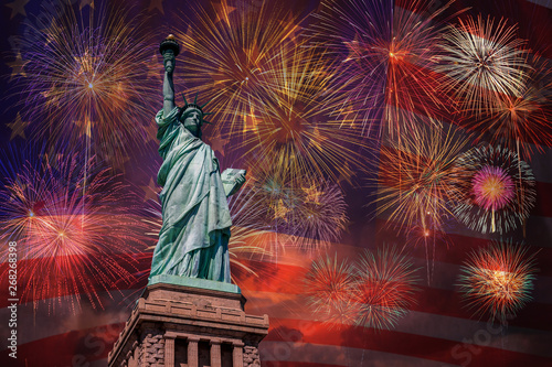 Statue of Liberty over the Multicolor Fireworks Celebrate with the United state of America USA flag background, 4th of July and Independence day concept