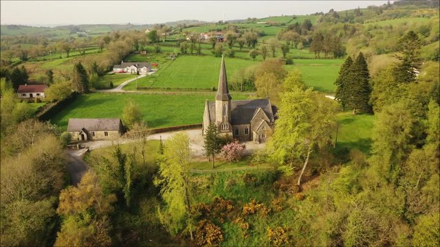 Aerial footage of gothic style church in Cooneen, Ireland