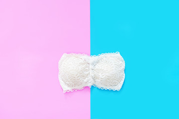 Beautiful White Lace Underwear Isolated on Blue and Pink Color Pastel for Valentine is Day. Set of Accessory Lingerie (Bikini) Fabric. Woman is Lace Sexy Bra (Brassiere) on Two Tone Background.