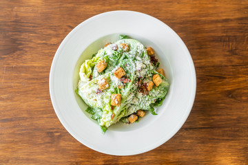 Caesar salad on white plate