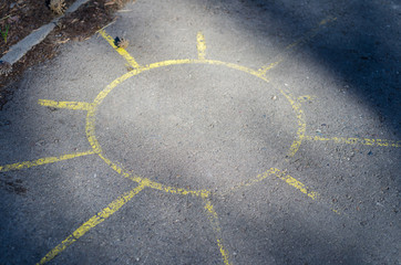 sun drawing on asphalt. Background and texture