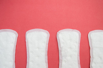 women's pads on pink background. Menstrual cycle, concept.