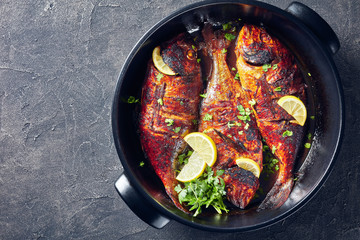 freshly grilled dorado fish in a dish