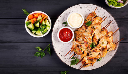 Chicken shish kebab. Shashlik - grilled meat and fresh vegetables. Top view