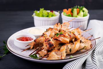 Chicken shish kebab. Shashlik - grilled meat and fresh vegetables.