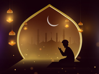 Silhouette of a man doing prayer (Namaz) in front of mosque in Eid Mubarak Festival. Poster or banner design.