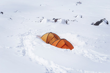 Base camp under the Mount Elbrus. The altitude is 3800 m. The northern exposure. The spring is ascending.