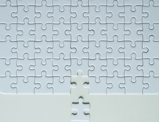 Jiigsaw puzzle white color,Puzzle pieces grid,Concept partnership business successful teamwork