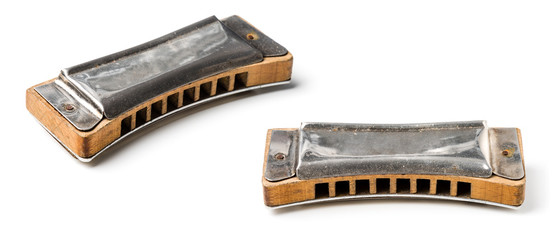 vintage harmonica isolated over white background
