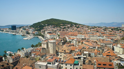 Fototapeta na wymiar Scenic aerial view of coast and roofs from the bell tower, beautiful cityscape, sunny day, Croatia Adriatic sea, Split, Croatia
