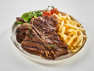 Barbecued T-bone steak with pommes de frites