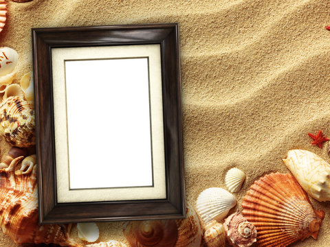 Picture frame on shells and sand background