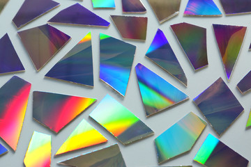 Shiny iridescent splinters on white background
