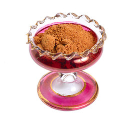 Coconut sugar in wintage glass bowl. Isolated on white background