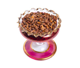 Grape seed in wintage glass bowl. isolated