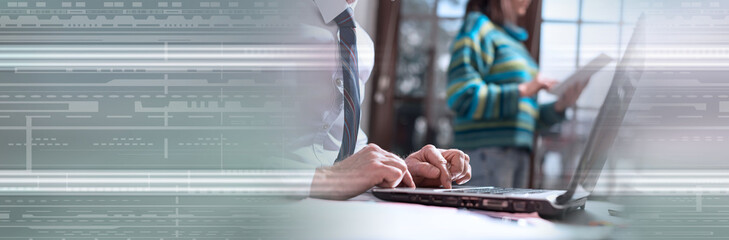 Businessman working on laptop. panoramic banner